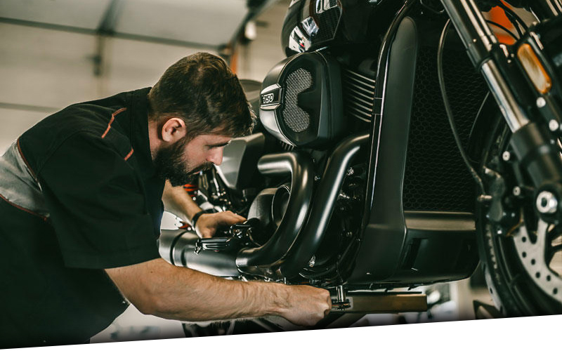 Harley service tech working on a bike